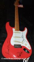 Fender Stratocaster signed by David Gilmour, Nick Mason and Richard Wright.
03.07.2006, London.
 Brain Damage