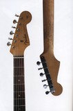 Showing wear on the front and back of the rosewood neck.